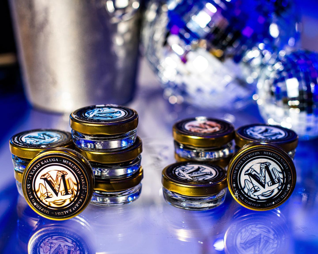A product display of an assortment of Meredith Marks Caviar jars.