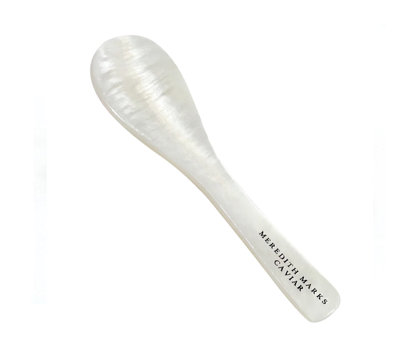 Non-metallic mother-of-pearl spoon designed to preserve caviar flavor.